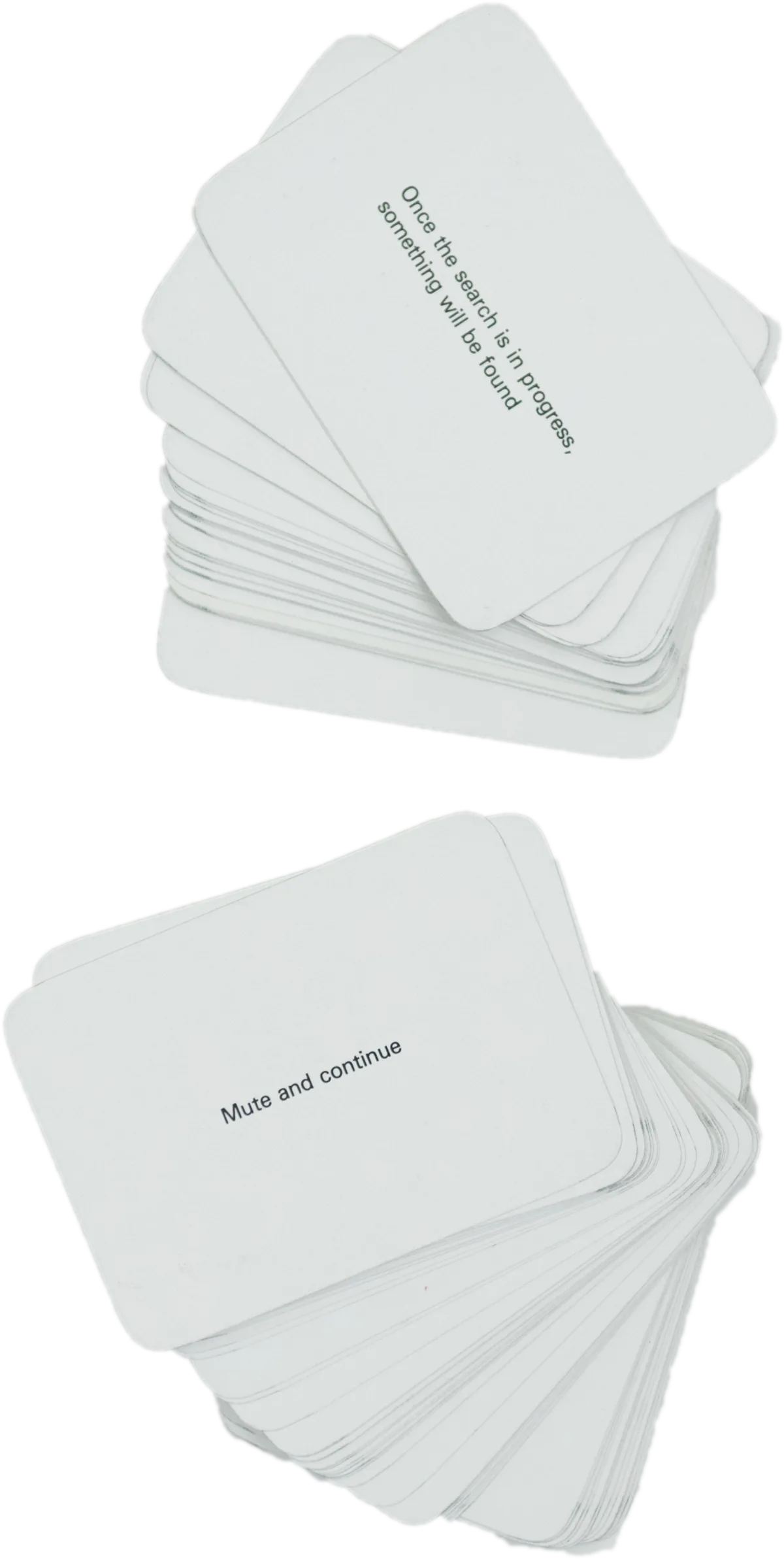 Fanned stacks of Oblique Strategies cards: “Once the search is in progress, something will be found”; “Mute and continue.”